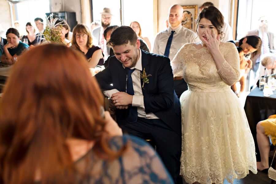 The bride starts to cry listening to her bridesmaid's speech.